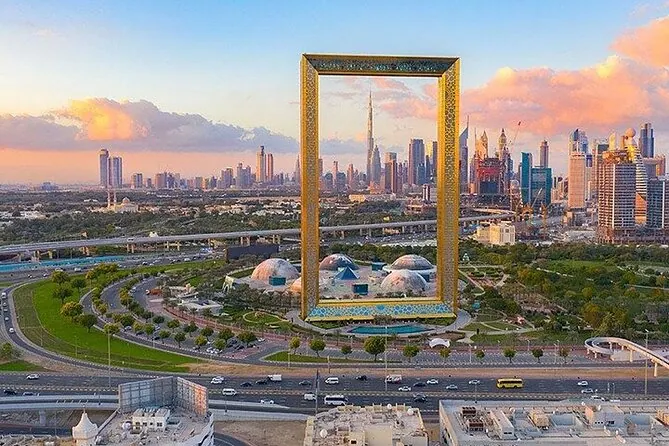 The Dubai Frame at sunset with the Downtown Dubai skyline behind it