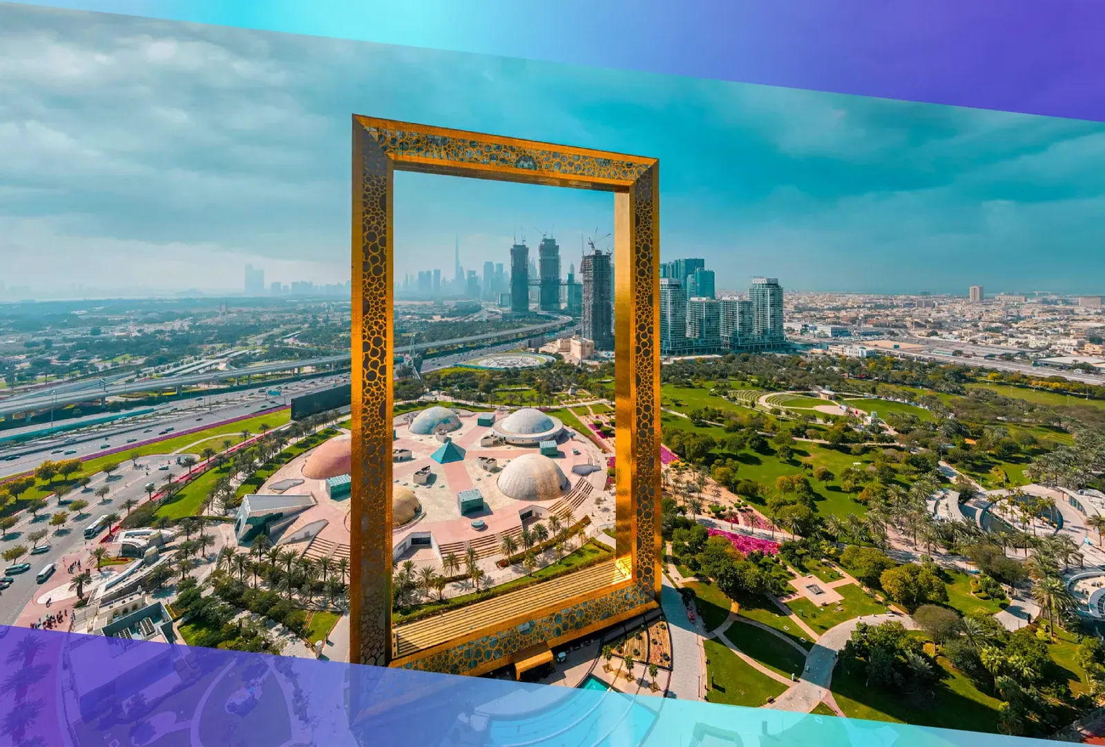 Aerial view of the Dubai Frame with Zabeel Park and the skyline behind it